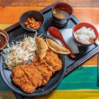 Chicken Katsu · Breaded and crispy chicken thigh served with steamed rice, miso soup, side salad