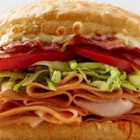 Turkey Bacon Club Sandwich · turkey | bacon | 3 cheeses | lettuce | tomato | lite mayo | signature sauce | sourdough bun.