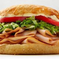 Smoked Turkey Breast Sandwich · turkey | lettuce | tomato | lite mayo | sourdough bun.