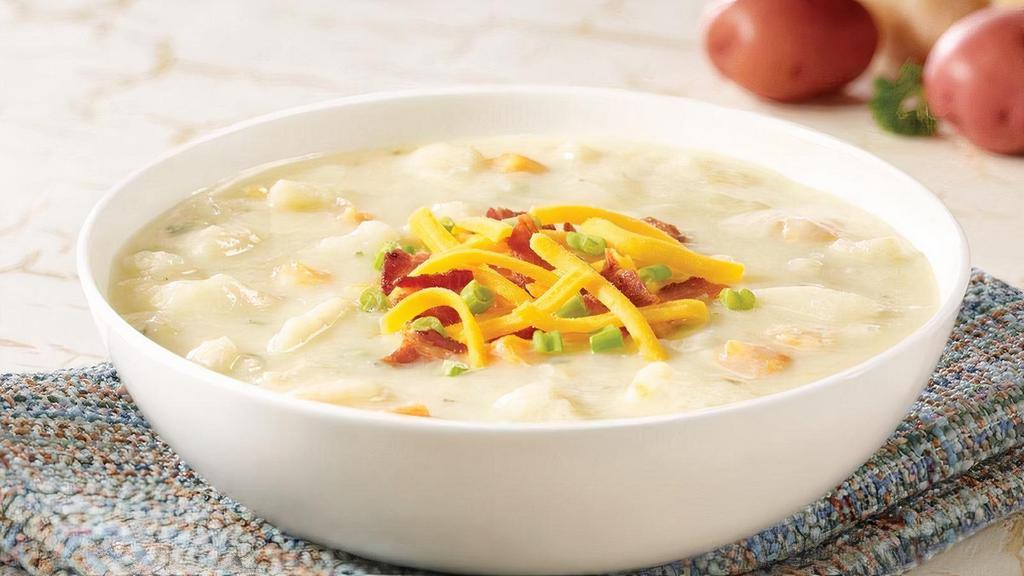 Loaded Baked Potato Soup · Hearty cream soup with potatoes and bacon bits. Topped with cheddar cheese, bacon bits and green onions.