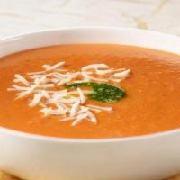 Tomato Basil · Fresh, ripe tomatoes, basil and onions blended into a smooth, creamy soup. Topped with crout...