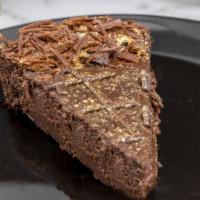 Chocolate Truffle Torte · Fudgy dark chocolate, chocolate creme cheese, chocolate shavings, dark chocolate drizzle