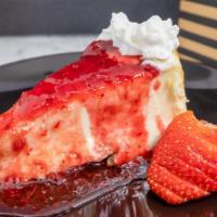 Strawberry Cheesecake · Sweet and creamy cheesecake, strawberry topping, whipped cream, graham cracker crust