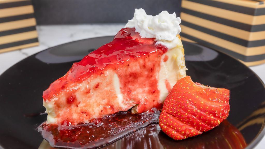 Strawberry Cheesecake · Sweet and creamy cheesecake, strawberry topping, whipped cream, graham cracker crust