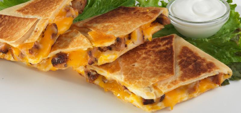 Quesadilla · Warm melted cheese and meat wrapped in a warm flour tortilla