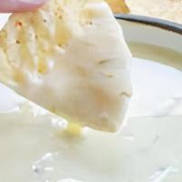 Custom Queso · Queso blanco with your choice of tasty additions.