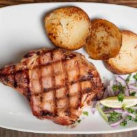 Chuleta De Puerco Ahumada · 2 Smoked Pork Chops with grilled onions