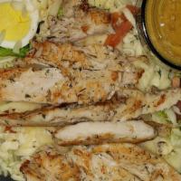 Fried Or Grilled Chicken Salad · Mixed salad greens topped with fried or grilled chicken tenders, mushrooms, tomatoes, and Mo...