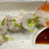 Cristal Shrimp Dumpling · Five pieces. Steamed shrimp dumplings and home made dumpling sauce.