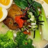 Black And White Ramen · Braised pork belly, bok choy, broccoli, bean sprouts, and boiled egg. Ramen made in house.