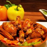 Chicken Wings · Plain, spicy or BBQ sauce. Served with carrots, celery and blue cheese.