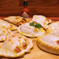 Empanadas · Oven baked, with your choice of ham and cheese chicken or meat. Each.