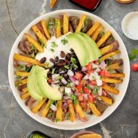 Mexican Mayhem Sweet Potato Fries · (Vegetarian) Jalapenos, black beans, guacamole, and melted cheese topped on sweet potato fri...