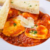 Four Cheese Blend Ravioli · ravioli stuffed with ricotta, Parmesan, Asiago, Romano cheeses served with fresh parsley, Ro...