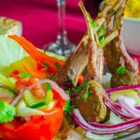 Tandoori Lamb Chops · Australian rack of lamb marinated with yogurt and herbs char grilled.