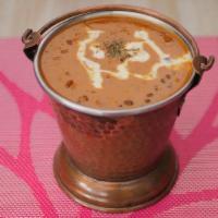 Dal Makhani · Slow cooked creamy black lentils with spices and butter.