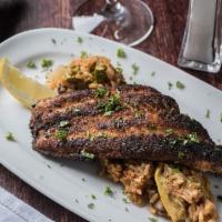 Blackened Catfish · Served with crawfish rice pilaf and 1 side. Add a fillet of catfish for an additional charge.