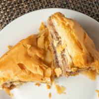 Baklava · Traditional honey-soaked filo pastry filled with walnuts and almonds.
