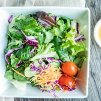 Salad With Ginger Dressing · Fresh garden mixed salad with house blend ginger dressing.