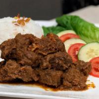 Padang Rendang Beef · Spicy. 24 hours blow raised spicy strip loin and tendon.