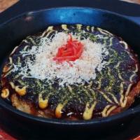 A-9. Okonomiyaki · Seafood pancake grilled on round skillet.