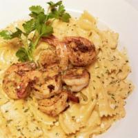 Cajun Shrimp Pasta · Cajun grilled shrimp on top of bowtie pasta in the creamy homemade cajun sauce.