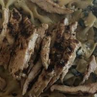 Spinach With Chicken Alfredo · Spinach with bowtie pasta in creamy Alfredo sauce topped with grilled chicken.