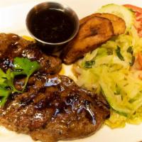 Grilled Steak · Grilled to perfection and cooked with red wine and mushroom sauce or bourbon butter sauce.