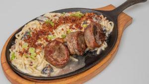 Filet Mignon With Truffle Fettuccine · 12 oz. of filet mignon cooked to your liking with a creamy truffle fettuccine, with bacon po...