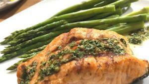 Grilled Salmon · 8 oz. salmon grilled with its skin, served with asparagus, and handmade chimichurri.