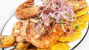 Seafood Grill · Calamari, shrimp, king prawns, tostones, and coleslaw.