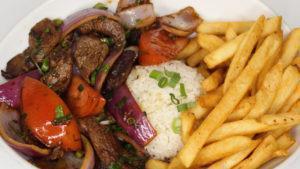 Lomo Saltado · Served with rice, and french fries.