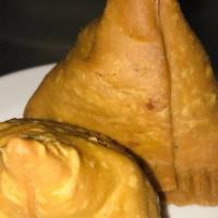 Meat Samosa · Triangular patties stuffed ground lamb and peas served with mint and tamarind sauce.