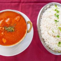 Chicken Tikka Masala · Most popular tender white meat chicken cooked with butter, tomatoes and herbs. Served with b...