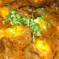 Lamb Vindaloo   · Spicy. Fiery hot lamb cooked in vinegar and spices, a traditional lamb dish. Served with bas...