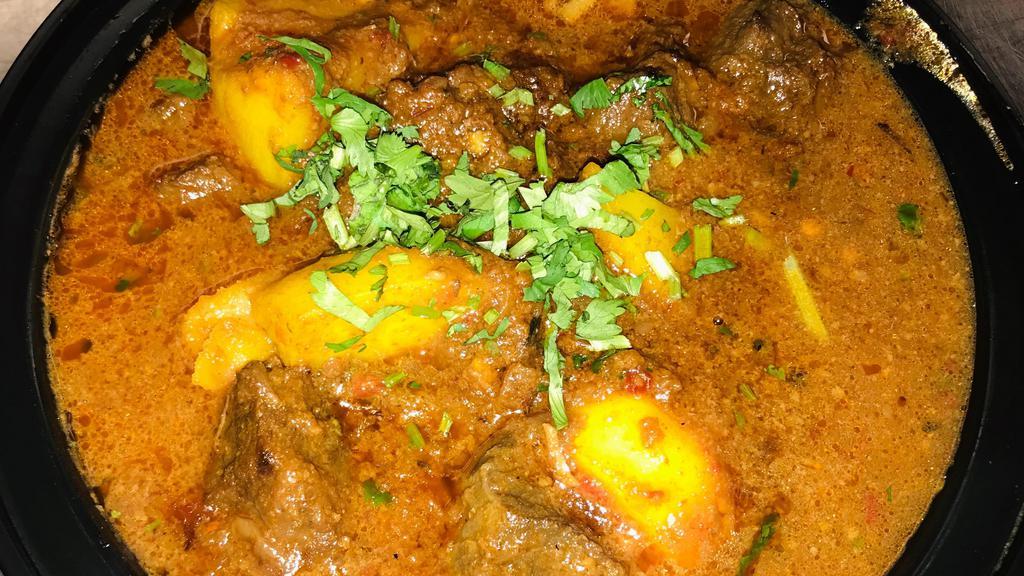 Lamb Vindaloo   · Spicy. Fiery hot lamb cooked in vinegar and spices, a traditional lamb dish. Served with basmati rice.