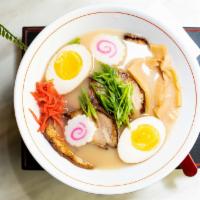 Tonkotsu Ramen · Ramen noodle, Chashu pork, naruto, soft boiled egg, green onions, sesame seeds, sliced bambo...