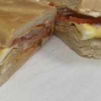 Breakfast Tortilla Sandwich/Wrap · Served with your choice of protein, eggs and cheese on your choice of bread or wraps