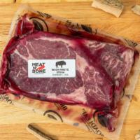 Bison Ribeye Steak · 12 oz domestic buffalo. Roasted garlic and marsala wine paired with feral wild boar, pork, b...