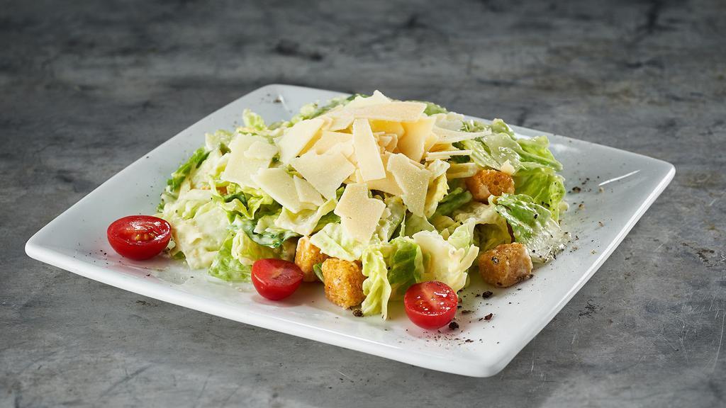 Caesar Salad · fresh romaine hearts, romano cheese, creamy caesar dressing, shaved parmesan and fresh ground black pepper