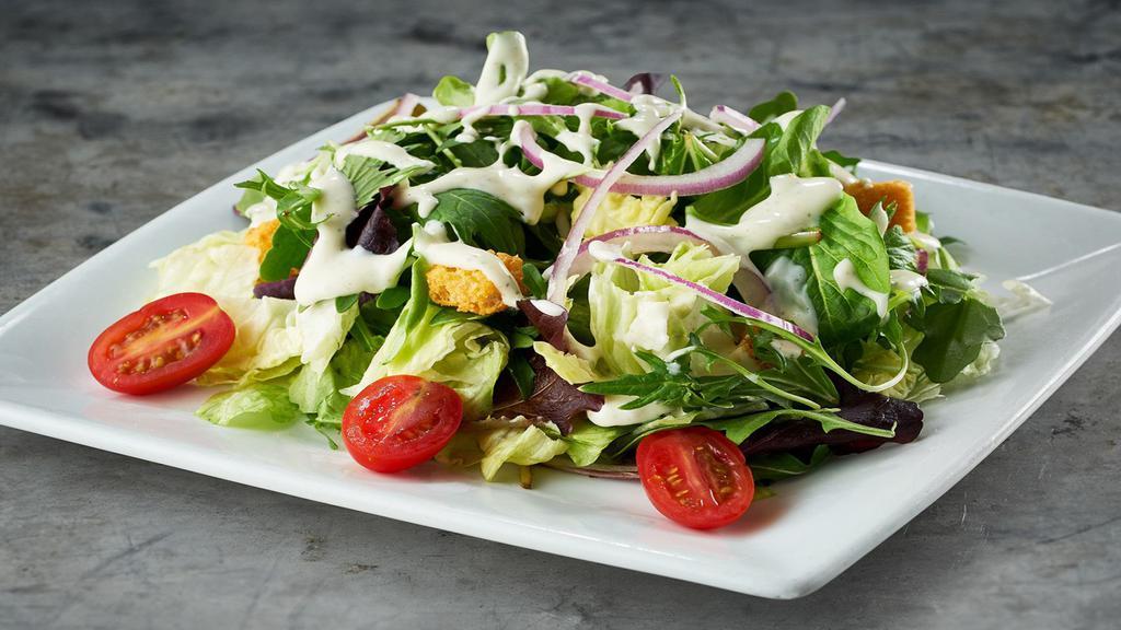 House Salad · Iceberg, baby arugula, baby lettuces, grape tomatoes, garlic croutons, red onions