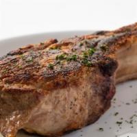 Pork Chop  · Center cut chop, fine-grained, flavorful & served with sizzling, sliced cinnamon apples