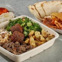 Shawarma Platter  · Chicken, Beef and Two Falafel croquettes.  Pilaf Rice topped with almonds, and Tabbouleh Sal...