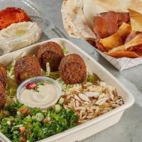 Vegetarian Platter  · Five crispy Falafel croquettes. Pilaf Rice topped with almonds, Tabbouleh salad. Accompanied...
