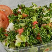 Tabbouleh Salad · Fresh parsley, green onion and tomatoes, arabic spices, Lebanese olive oil and a lot of lemo...