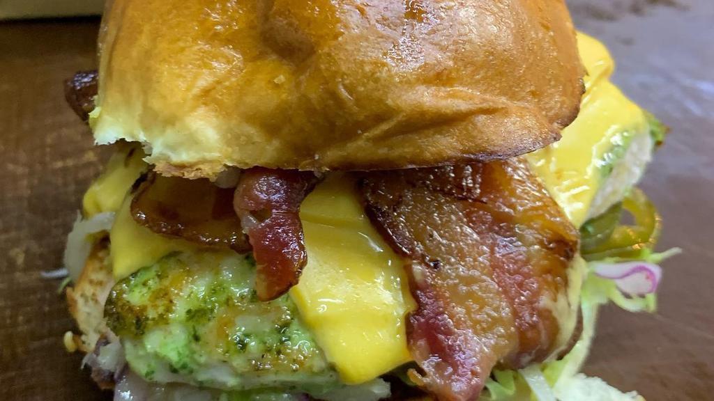 Triple Bacon Cheese Smashmouth · Three of our signature smashed hamburger patties with bacon, American cheese, lettuce, tomato, onion, pickles, and mayo.