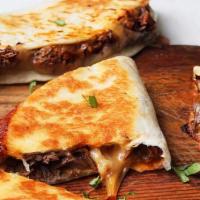 Boca'S Best Quesadilla · Large portion of chicken or steak served with salsa and sour cream and dusted with a Mexican...