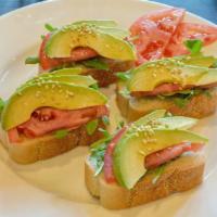 Avocado · 4 slices of toasted french bread, arugula, tomato, avocado, dressed with olive oil and seaso...