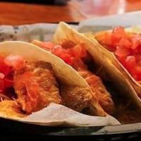 Fish Tacos · 6 0z of fried tilapia served on 3 flour tortilla topped with dabomb sauce lettuce tomato and...