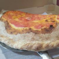 Calzone Classico · Tomato sauce, mozzarella, ham, basil.